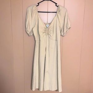 Dress that is extra large and is tan